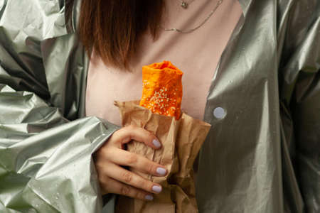 Close up of burrito in woman's hndsの写真素材