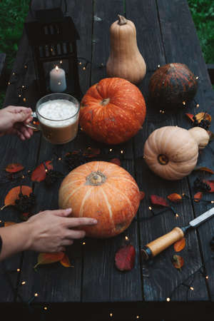 Halloween decorations Pumpkins on wooden table outdoors.の写真素材