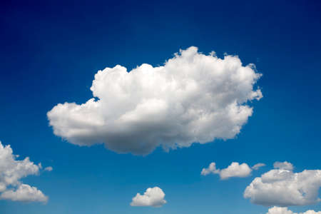 Fluffy white clouds in blue skyの写真素材