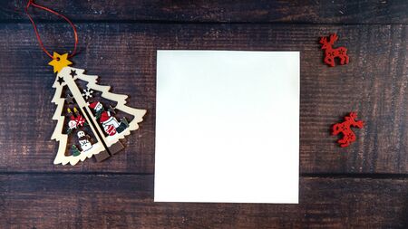 Merry Christmas - poster or postcard design on a wooden background. Place for text.