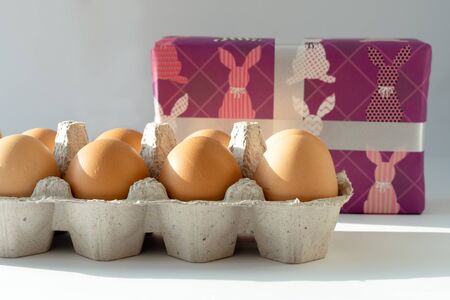 Easter eggs and gift on a white background. Happy easter.