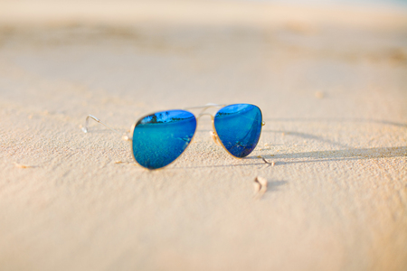 Sunglasses on the sandの写真素材
