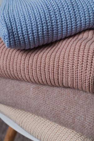 Four colored wool blankets. Close-up fabric texture. No model