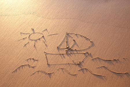Drawing in the sand on the atlantic coastの写真素材