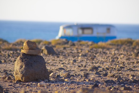 An old, rusty, vintage, surfing, camping, van on the coast.の写真素材