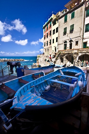 Fisherman village  Riomaggiore is one of five famous colorful villages of Cinque Terre in Italy, suspended between sea and land on sheer cliffs upon the  turquoise sea のeditorial素材