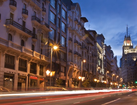 Rays of traffic lights on Gran via street, main shopping street in Madrid at night. Spain.の写真素材