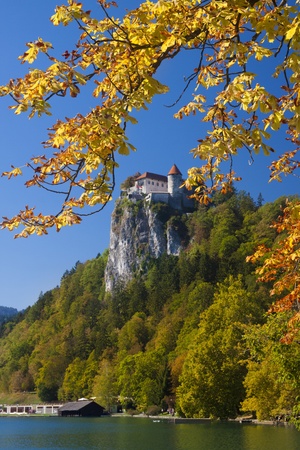 Colorful Bled in fall, with the rock top castle in the background. Sloveniaの写真素材