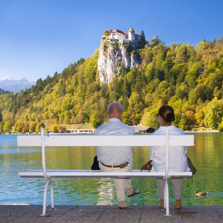 Senior couple enjoying the beautiful Bled panorama, Sloveniaの写真素材