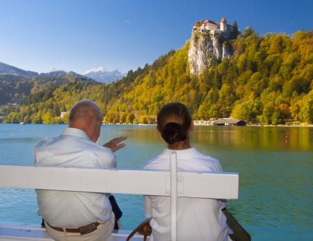 Senior couple enjoying the beautiful Bled panorama, Sloveniaの写真素材