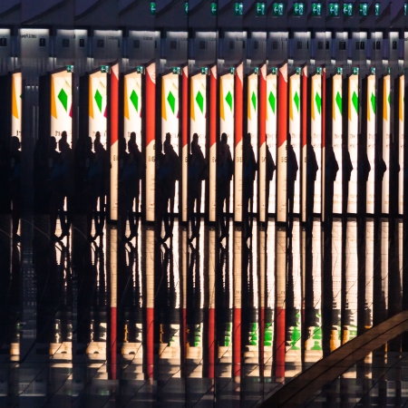 Reflextions of the man with the suitcase on the airpor hall の写真素材