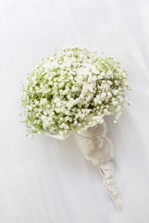 Wedding bouquet on a white vail.の写真素材