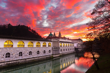 Ljubljana, Slovenia, Europe - Ljubljanica River and Central Market in sunset.  Ljubljana open market buildings was designed by famous architect JoÅ¾e Plecnik.のeditorial素材