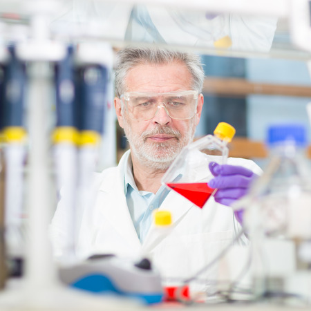 Life scientist researching in laboratory. Life sciences comprise fields of science that involve the...