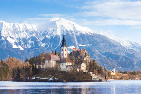 Panoramic view of Julian Alps, Lake Bled with St. Marys Church of the Assumption on the small island; Bled, Slovenia, Europe.の写真素材