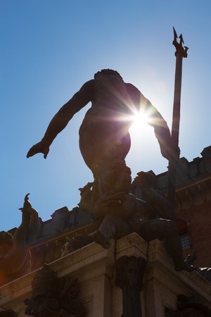 Silhouette of Fountain of Neptune, monumental civic fountain located in the eponymous square Piazza Nettuno next to Piazza Maggiore in Bologna, Italy の写真素材