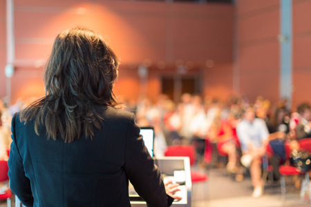 Business woman lecturing at Conference  Audience at the lecture hall の写真素材