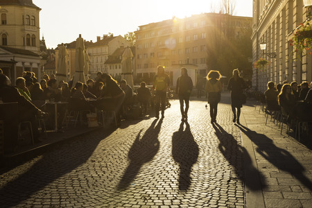 Ljubljana, Slovenia - October 30, 2014: People terracing (sitting, drinking coffee and people watching) in lively Ljubljana city center in the afternoon sun.のeditorial素材