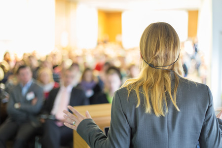 Female speaker at Business Conference and Presentation. Audience at the conference hall. Business and Entrepreneurship. Business woman.の写真素材