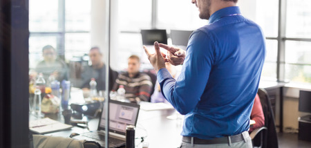 Business man making a presentation at office. Business executive delivering a presentation to his...
