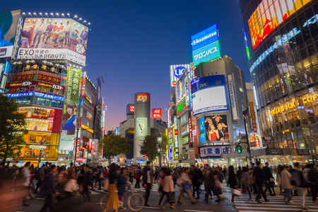 Tokyo, Japan - November 6, 2015: Pedestrians cross at Shibuya Crossing on November 6th in Tokyo, Japan, 2015. Shibuya Crossing is one of the busiest crosswalks in the world.のeditorial素材