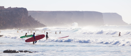 EL Cotillo, Spain - Dec 17, 2015:  Active sporty people having fun learning to surf on El Cotillo beach, famous surfing destination on Fuerteventura, Canary Islands, Spain on December 17, 2015.のeditorial素材