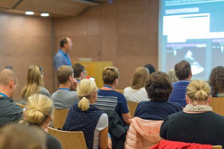 Speaker Giving a Talk at Business Meeting. Audience in the conference hall. Business and...