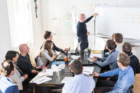 Relaxed informal IT business startup company meeting. Team leader discussing and brainstorming new...