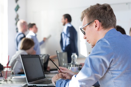 Relaxed informal IT business startup company meeting. Team leader discussing and brainstorming new...