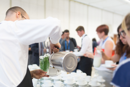 Coffee break at conference meeting. Business and entrepreneurship.の写真素材