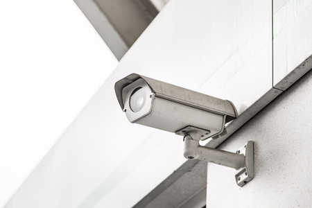 CCTV surveillance security camera video equipment in tower home and house building on wall for...