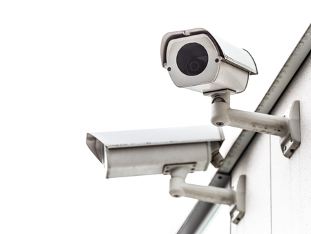 CCTV surveillance security camera video equipment in tower home and house building on wall for safety system area control outdoor with copyspace.の写真素材