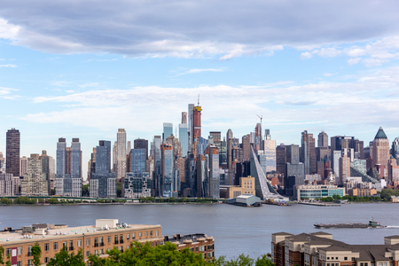 New York City midtown Manhattan skyline panorama view from Boulevard East Old Glory Park over Hudson River.の写真素材