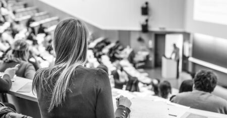 Conference and Presentation. Audience at the conference hall. Business and Entrepreneurship. Faculty lecture and workshop. Audience in the lecture hall. Academic education. Student making notes.の写真素材
