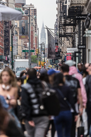 New York, NY, USA - May 17, 2018: Crowds of defocused people walking sidewalk of Broadway avenue in Soho of Midtown Manhattan on may 17th, 2018 in New York City, USA.のeditorial素材