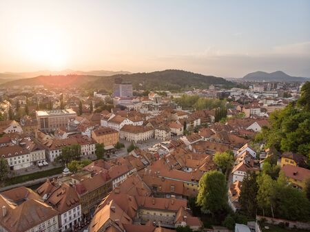Aerial view of Ljubljana, capital of Slovenia. Roooftops of Ljubljanas old medieval city center seen from Ljubljanas castle at sunset.の写真素材