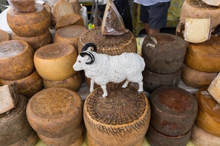Various traditional Italian cheese on a market stand.の写真素材