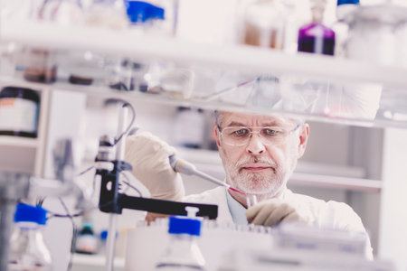 Life scientist researching in laboratory. Life sciences study living organisms on the level of microorganisms, viruses, human, animal and plant cells, genes, DNA...の写真素材