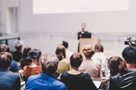 Woman giving presentation on business conference.の写真素材