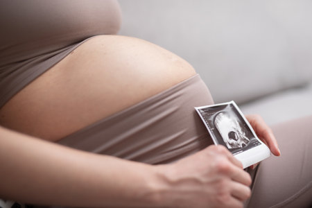 Pregnant woman belly. Pregnancy Concept. Pregnant tummy close up. Detail of pregnant woman relaxing...