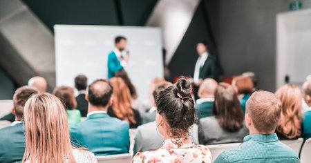 Pitch presentation and project discussion at business convention or team meeting. Audience at the conference hall. Business and entrepreneurship symposiumの素材 [FY310201592403]