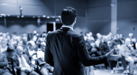 Speaker at Business Conference with Public Presentations. Audience at the conference hall....