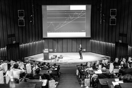 Speaker Giving a Talk at Business Meeting. Audience in the conference hall. Business and Entrepreneurship concept.の写真素材