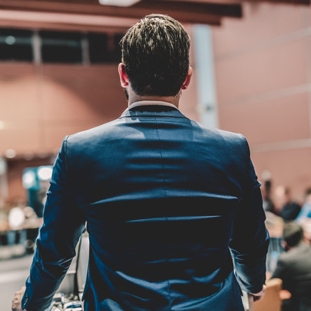Speaker giving a talk on corporate Business Conference. Audience at the conference hall. Business and Entrepreneurship event.の写真素材