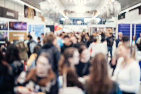 Abstract blurred people at exhibition hall of expo event trade show. Business convention show or job...