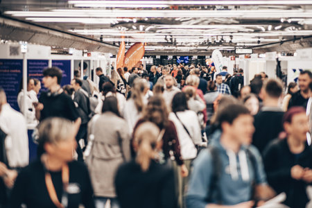 Abstract blurred people at exhibition hall of expo event trade show. Business convention show or job fair. Business concept backgroundの写真素材