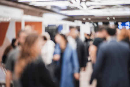 Abstract blurred people at exhibition hall of expo event trade show. Business convention show or job fair. Business concept backgroundの写真素材
