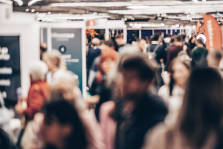 Abstract blurred people at exhibition hall of expo event trade show. Business convention show or job fair. Business concept backgroundの写真素材