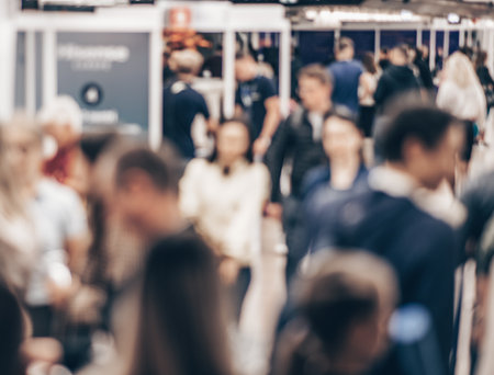 Abstract blurred people at exhibition hall of expo event trade show. Business convention show or job fair. Business concept backgroundの写真素材