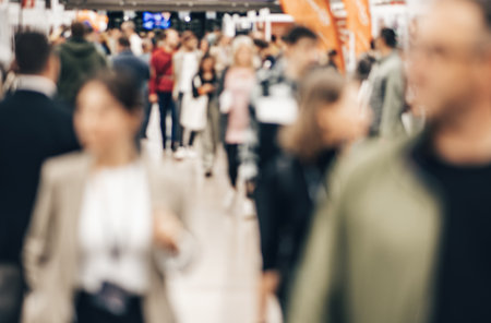 Abstract blurred people at exhibition hall of expo event trade show. Business convention show or job fair. Business concept backgroundの写真素材